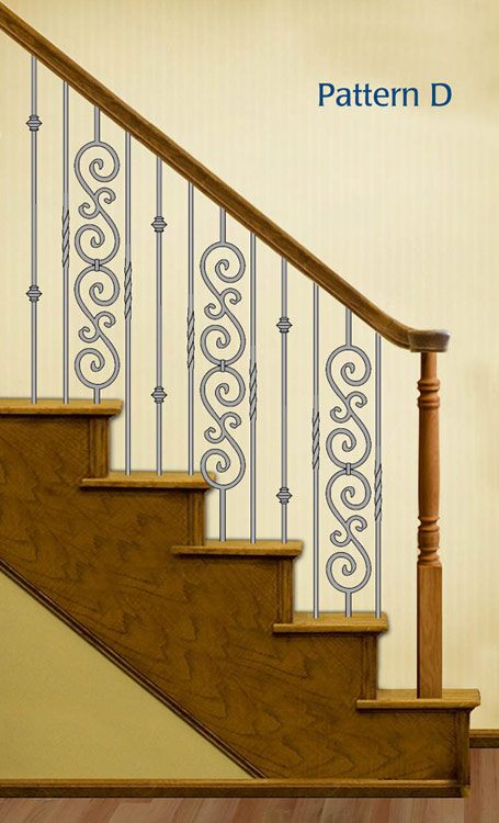 Wrought iron stair balusters with intricate design