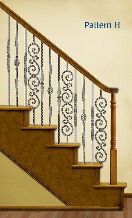 Wrought iron stair balusters with intricate patterns