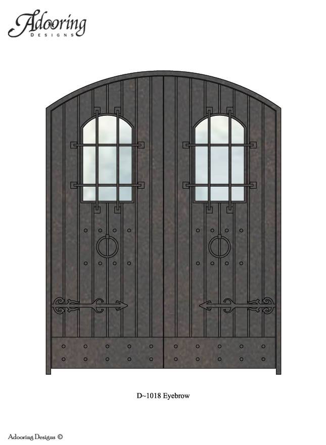 Large window in door with eyebrow top and complex design