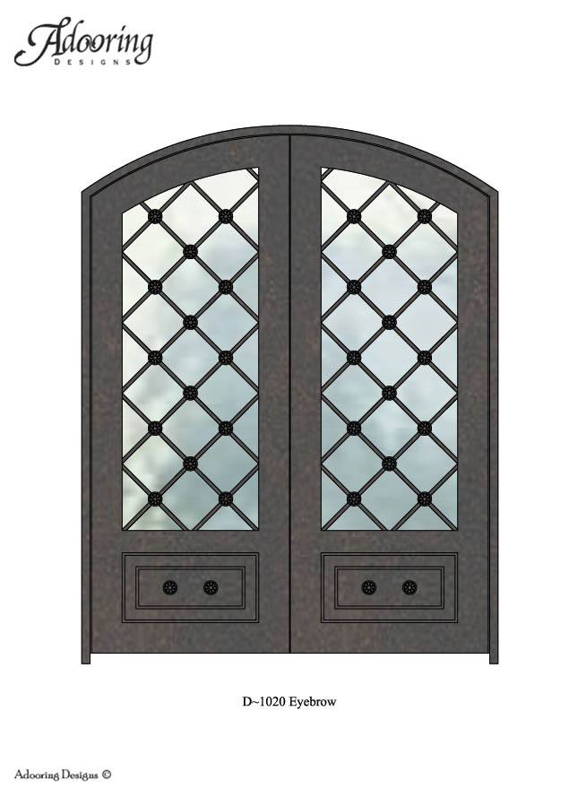 Large window in door with eyebrow top and complex pattern