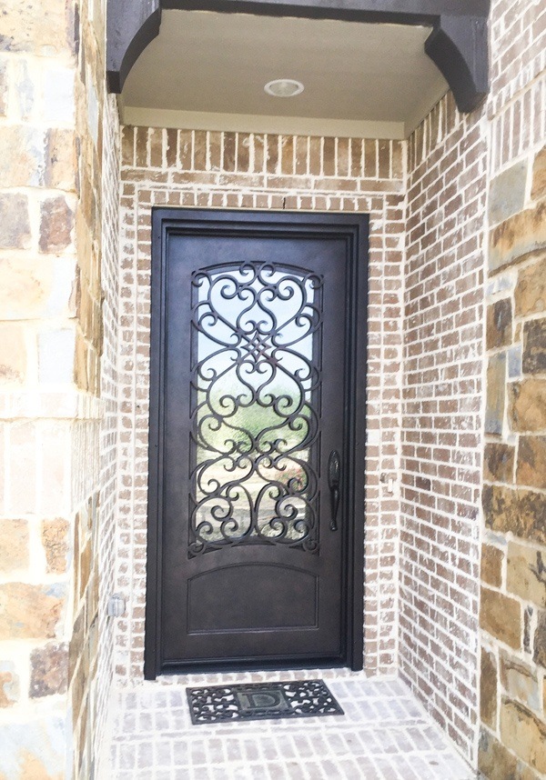 Intricate design on black iron door