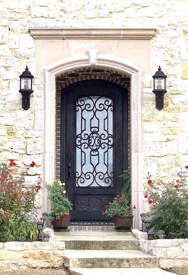 Black finish iron front door with intricate pattern