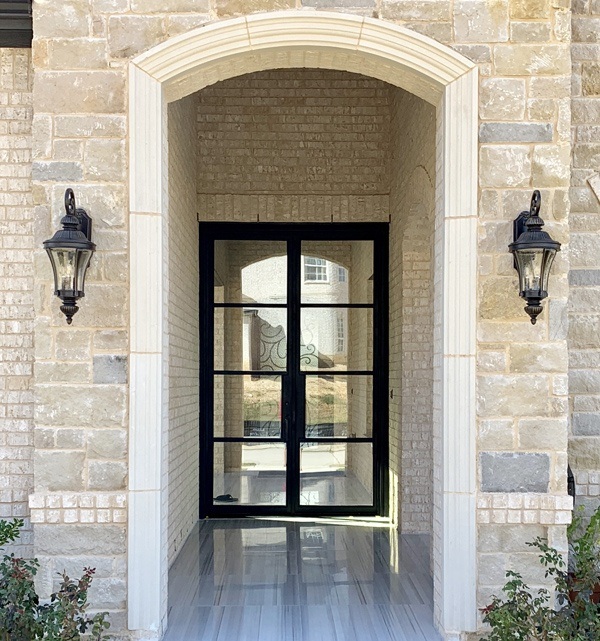 Simple iron front door with minimal framing