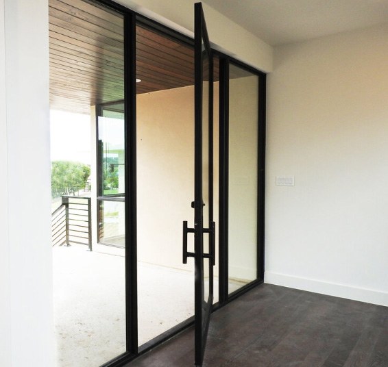 Large square top iron door with large windows on both side and only minimal framing