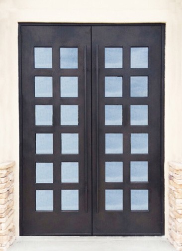 Large double iron front doors with square top and four rows of square windows