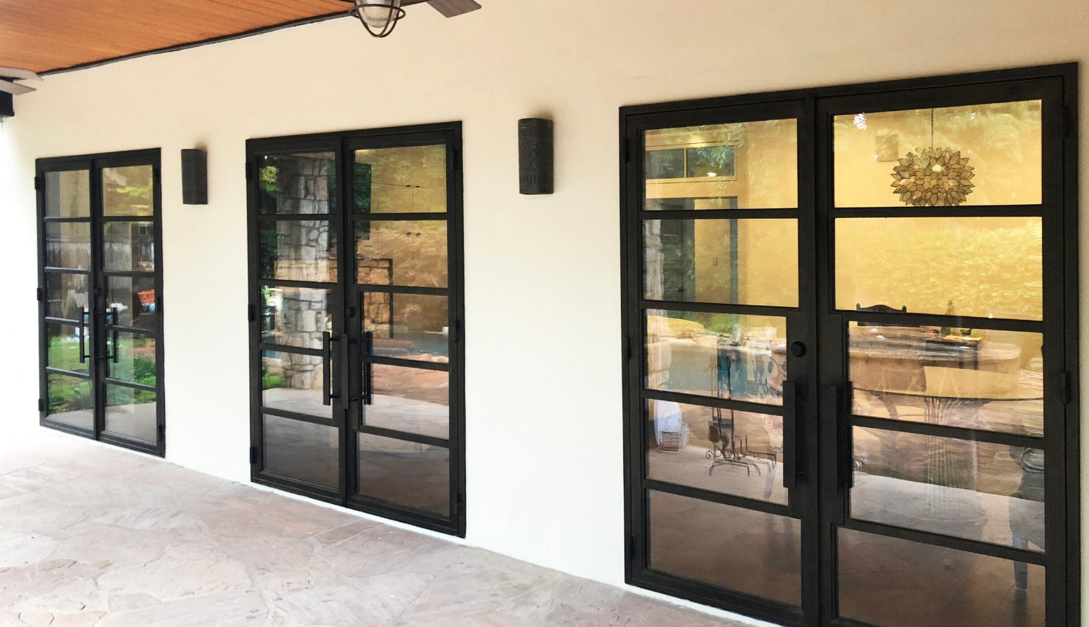 Three double doors made from black iron finish