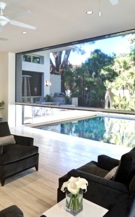 Patio shade opening to reveal backyard oasis