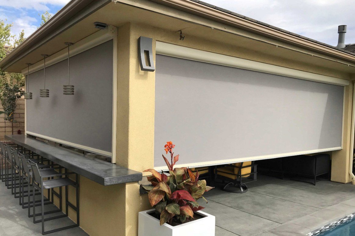 Outdoor bar and patio area enclosed with patio shades