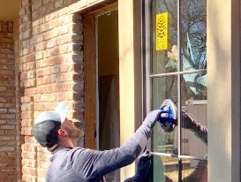 Team member installing custom replacement window