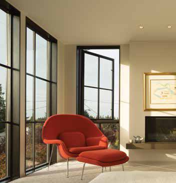 Red cozy chair in living room looking out over view from new windows