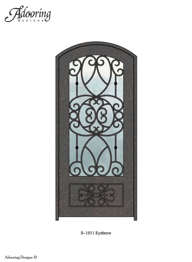 Large window in eyebrow top iron door with intricate pattern