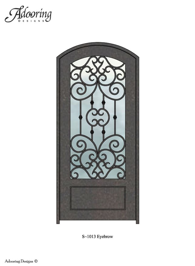 Large window in iron door with eyebrow top and intricate design