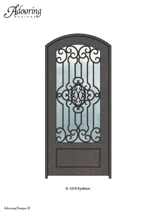 Large window in door with eyebrow top and intricate pattern