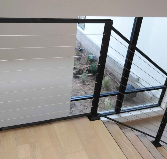 Simple iron and wire stair railing