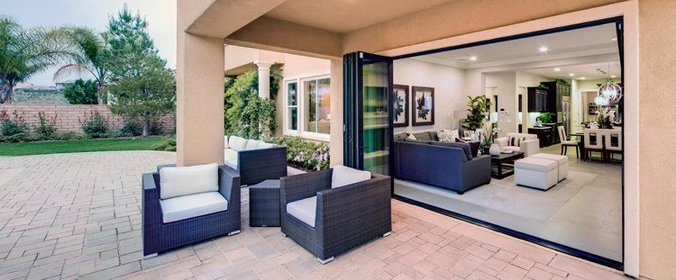 Seamless connection to indoor and outdoor living spaces through sliding glass wall