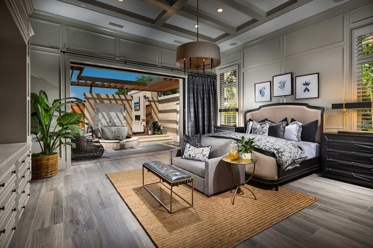 Master bedroom open to patio through sliding glass wall