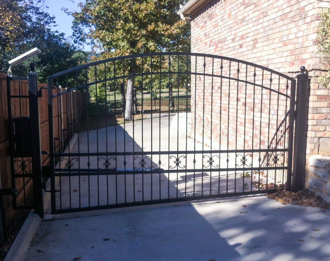Complex pattern iron driveway gate