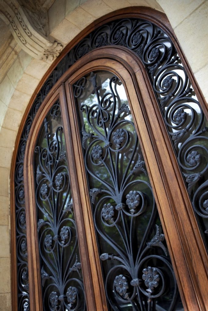 an up-close look of a wrought-iron door
