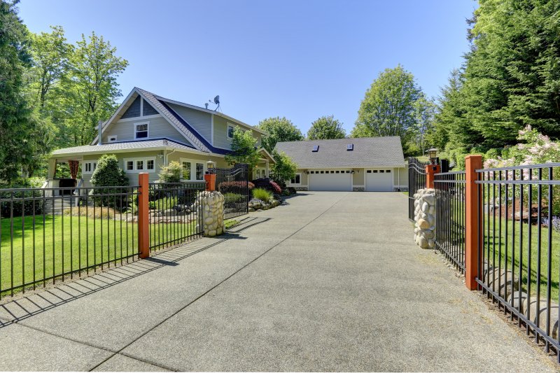 a beautiful home with iron gates 