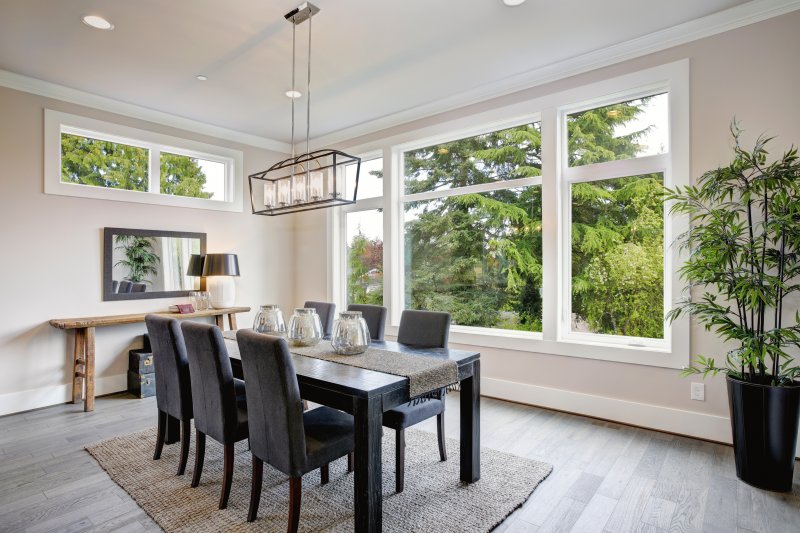 The dining room area of a home with new windows