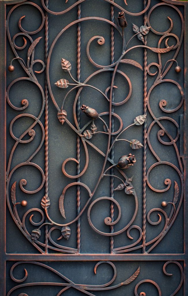 an image of a wrought iron door with round bars