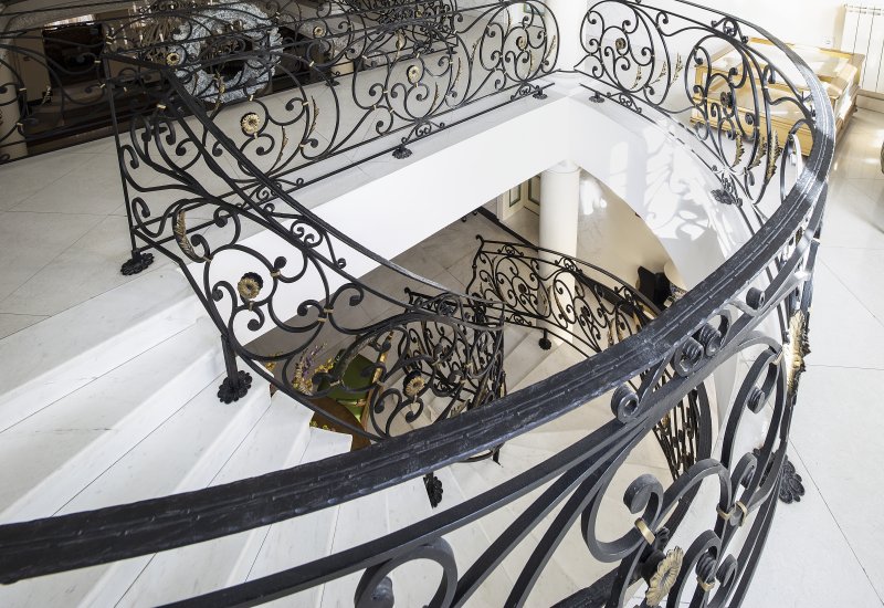 a wrought iron banister inside a home