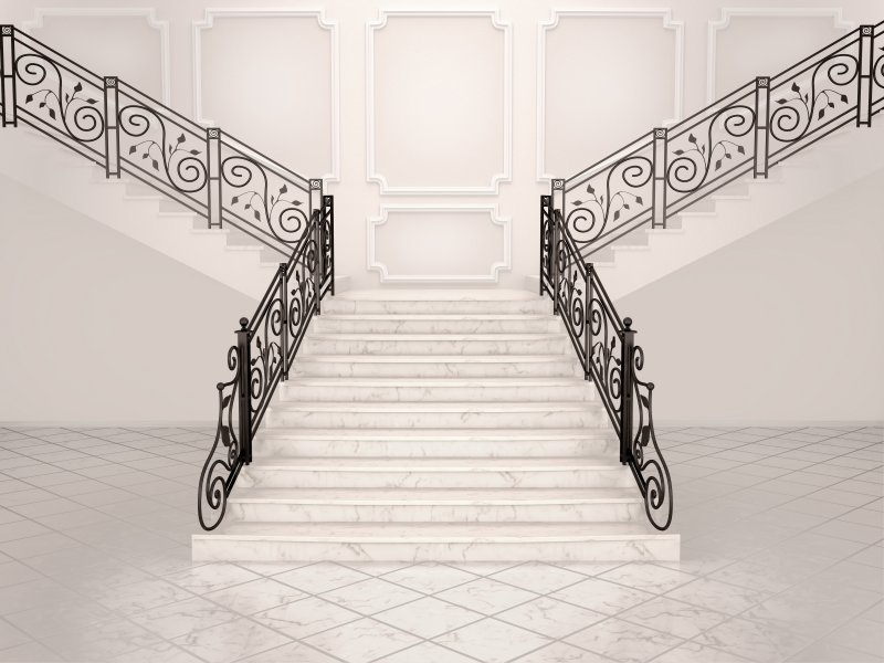 grand staircase with wrought iron railing