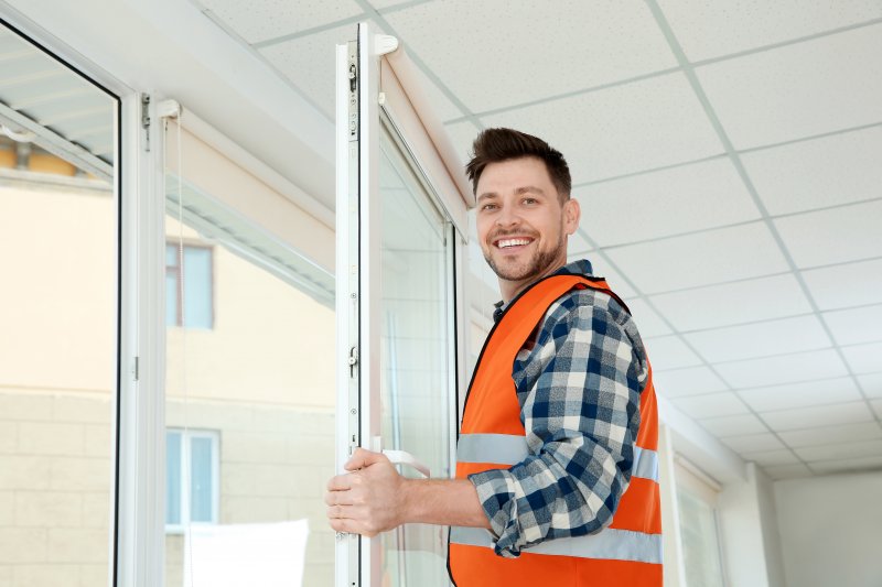 Man replacing windows inside a home